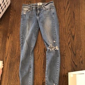 Women’s mid rise skinny jeans with holes